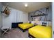 Minion-themed bedroom with twin beds and fun wall decor at 4611 Terrasonesta Dr, Davenport, FL 33837