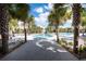 Large resort-style pool with palm trees and a water slide at 4611 Terrasonesta Dr, Davenport, FL 33837