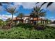 Gated community entrance with lush landscaping at 4611 Terrasonesta Dr, Davenport, FL 33837
