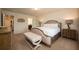 Bright bedroom with a plush bed, nightstands and an ensuite bathroom at 4611 Terrasonesta Dr, Davenport, FL 33837