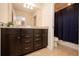 Bathroom with dark brown vanity, granite countertop, and a shower/tub combo at 4611 Terrasonesta Dr, Davenport, FL 33837