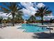 Stunning resort-style pool with a water feature and lounge chairs at 4611 Terrasonesta Dr, Davenport, FL 33837