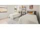 bedroom with twin beds, shelving, and decor at 6368 Chorus Dr, Mascotte, FL 34753