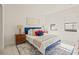 Bedroom with a queen bed, blue headboard and decor at 6368 Chorus Dr, Mascotte, FL 34753