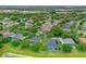 Aerial view of a house in a residential neighborhood near a lake at 706 Santee Terre Ln, Winter Garden, FL 34787