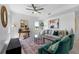 Serene living room with a neutral color palette, plush seating and large window at 6422 Chorus Dr, Mascotte, FL 34753