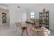 Bright home office features a desk, shelving, and comfortable seating at 6422 Chorus Dr, Mascotte, FL 34753
