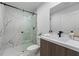 Clean bathroom with a walk-in shower and modern vanity at 6422 Chorus Dr, Mascotte, FL 34753