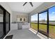Covered outdoor kitchen with stainless steel appliances and granite countertops at 6422 Chorus Dr, Mascotte, FL 34753