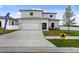 Two-story house with attached garage and modern facade at 6422 Chorus Dr, Mascotte, FL 34753