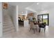 Modern dining area adjacent to kitchen and sliding glass doors at 6422 Chorus Dr, Mascotte, FL 34753