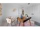 Light-filled home office with wood desk and stylish decor at 6422 Chorus Dr, Mascotte, FL 34753