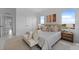 Spacious main bedroom with a comfortable bed and plenty of natural light at 6422 Chorus Dr, Mascotte, FL 34753