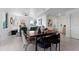 Modern dining area with a wooden table and chairs, near the kitchen at 6422 Chorus Dr, Mascotte, FL 34753