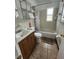 Updated bathroom with a shower/tub combo and wood vanity at 2805 Avenue M Nw, Winter Haven, FL 33881