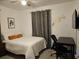 Cozy bedroom with a double bed and a workspace at 2805 Avenue M Nw, Winter Haven, FL 33881