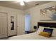 Bedroom with a queen bed and large wall art at 2805 Avenue M Nw, Winter Haven, FL 33881