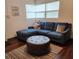 Cozy living room featuring sectional sofa and ottoman at 2805 Avenue M Nw, Winter Haven, FL 33881