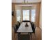 Bright dining room with a bay window and elegant chandelier at 1124 Chateau Cir, Minneola, FL 34715