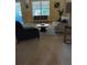 Spacious living room featuring comfortable seating and large windows at 1124 Chateau Cir, Minneola, FL 34715