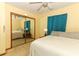 Spacious bedroom with mirrored closet and king-size bed at 2037 Apricot Dr, Deltona, FL 32725