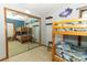 Bedroom with bunk beds and mirrored closet at 2037 Apricot Dr, Deltona, FL 32725