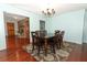 Dining room with hardwood floors, dark wood table and chandelier at 2037 Apricot Dr, Deltona, FL 32725