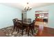 Bright dining room features a wood table with six chairs and a view into the kitchen at 2037 Apricot Dr, Deltona, FL 32725