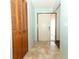 Light teal entryway with wood-paneled closet and tile floor at 2037 Apricot Dr, Deltona, FL 32725