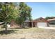 Brick ranch home with a two-car garage at 2037 Apricot Dr, Deltona, FL 32725