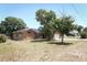 Brick house with solar panels and attached garage at 2037 Apricot Dr, Deltona, FL 32725