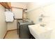 Laundry room with washer, dryer, utility sink and shelving at 2037 Apricot Dr, Deltona, FL 32725