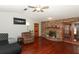 Living room with hardwood floors, fireplace, and French doors at 2037 Apricot Dr, Deltona, FL 32725
