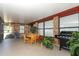 Relaxing screened porch with seating and potted plants at 2037 Apricot Dr, Deltona, FL 32725