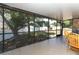 Overlooks backyard, featuring a large tree and shed at 2037 Apricot Dr, Deltona, FL 32725
