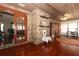 Sunroom with hardwood floors and brick walls at 2037 Apricot Dr, Deltona, FL 32725