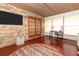 Sunroom with hardwood floors, round rug and ceiling fan at 2037 Apricot Dr, Deltona, FL 32725