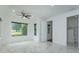 Bright bedroom with large windows and marble floors at 35635 High Pines Dr, Eustis, FL 32736