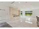 Open concept living area with marble floors and fireplace at 35635 High Pines Dr, Eustis, FL 32736