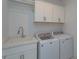 Laundry room with washer, dryer, and utility sink at 35635 High Pines Dr, Eustis, FL 32736