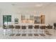 Gourmet kitchen boasts expansive island, stainless steel appliances, and marble countertops at 35635 High Pines Dr, Eustis, FL 32736