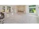 Open living area with marble floors and linear fireplace at 35635 High Pines Dr, Eustis, FL 32736