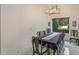 Bright dining room features a large table, chandelier, and view of the backyard at 35635 High Pines Dr, Eustis, FL 32736