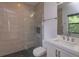 Modern bathroom with a glass shower and pebble floor at 35635 High Pines Dr, Eustis, FL 32736