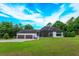Modern home exterior with attached garage and spacious backyard at 35635 High Pines Dr, Eustis, FL 32736