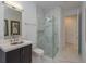 Bathroom with marble floors and a walk-in shower at 35635 High Pines Dr, Eustis, FL 32736