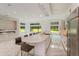 Modern kitchen with large island and marble countertops at 35635 High Pines Dr, Eustis, FL 32736