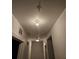 Interior hallway with light fixtures and doors leading to rooms at 960 Nw 56Th Ave, Ocala, FL 34482