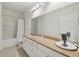 Clean bathroom with granite vanity and bathtub at 200 Southern Pecan Cir # 105, Winter Garden, FL 34787