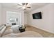 Spacious living room featuring a large sectional sofa and flat-screen TV at 200 Southern Pecan Cir # 105, Winter Garden, FL 34787